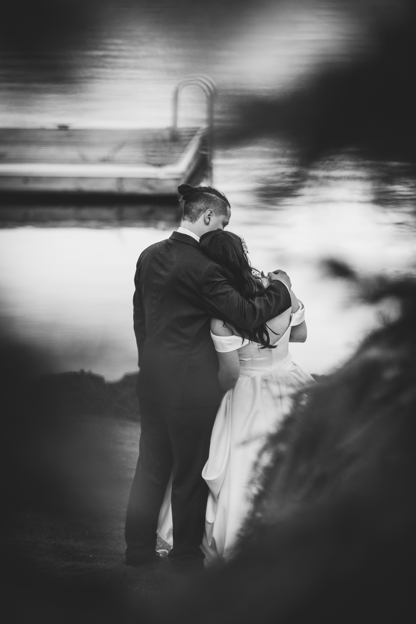 Bride and groom candid shot of hug moment during a resort wedding in Seattle captured by MXBloom Films Bride and groom candid shot of hug moment during a resort wedding in Seattle captured by MXBloom Films