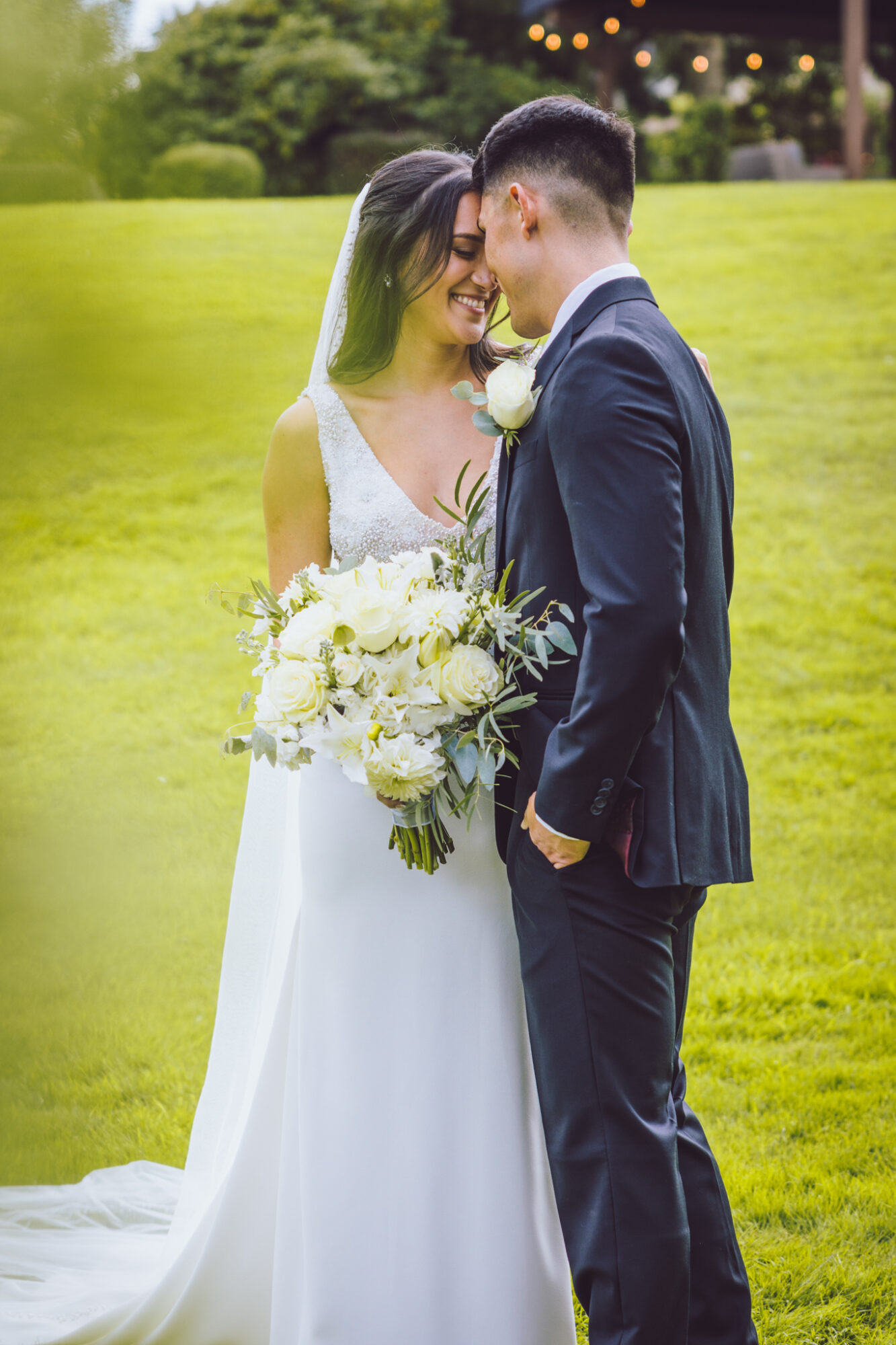 Bride and groom embracing at a farm wedding in Denver captured by MXBloom Films Bride and groom embracing at a farm wedding in Denver captured by MXBloom Films
